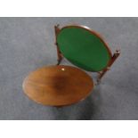 A 20th century oval occasional table on Queen Anne legs together with a folding oak card table