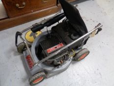 A Victa petrol lawn mower with grass box