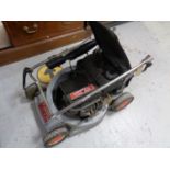 A Victa petrol lawn mower with grass box