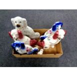 A box containing two pairs of Staffordshire spaniels together with two further Staffordshire