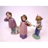 Three Nao figures, boy with teddy bear,