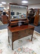 An Edwardian mahogany dressing chest with mirror by Robson's of Newcastle