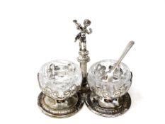 A vintage silver plated cruet with cherub standing on pillar