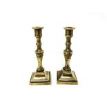 A pair of antique miniature brass candlesticks , height 8.5 cm.