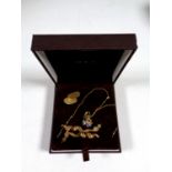 An 18ct gold cuff link together with a pair of 9ct gold earrings and a further pendant on 9ct gold