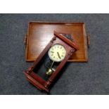 An oak twin handled serving tray together with a contemporary 31 day wall clock