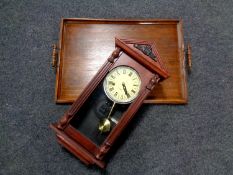 An oak twin handled serving tray together with a contemporary 31 day wall clock