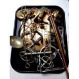 A tray of miscellaneous to include horse bits, stirrups, plated ladle, pair of miniature axes,