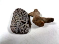 A carved stone pendant, face of a man,