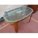 A 20th century walnut coffee table with glass panel top