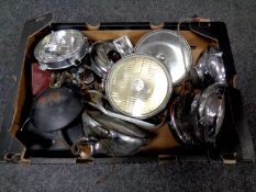 A box of vintage car head lamps