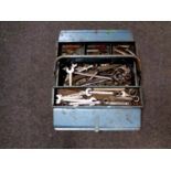 A metal concertina toolbox containing a large quantity of assorted spanners