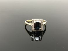 A diamond and sapphire cluster ring, size P CONDITION REPORT: Marks rubbed. 4.