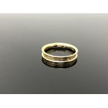 A 9ct gold diamond set band ring, size O.