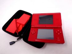 A Nintendo DS with stylus in carry case,