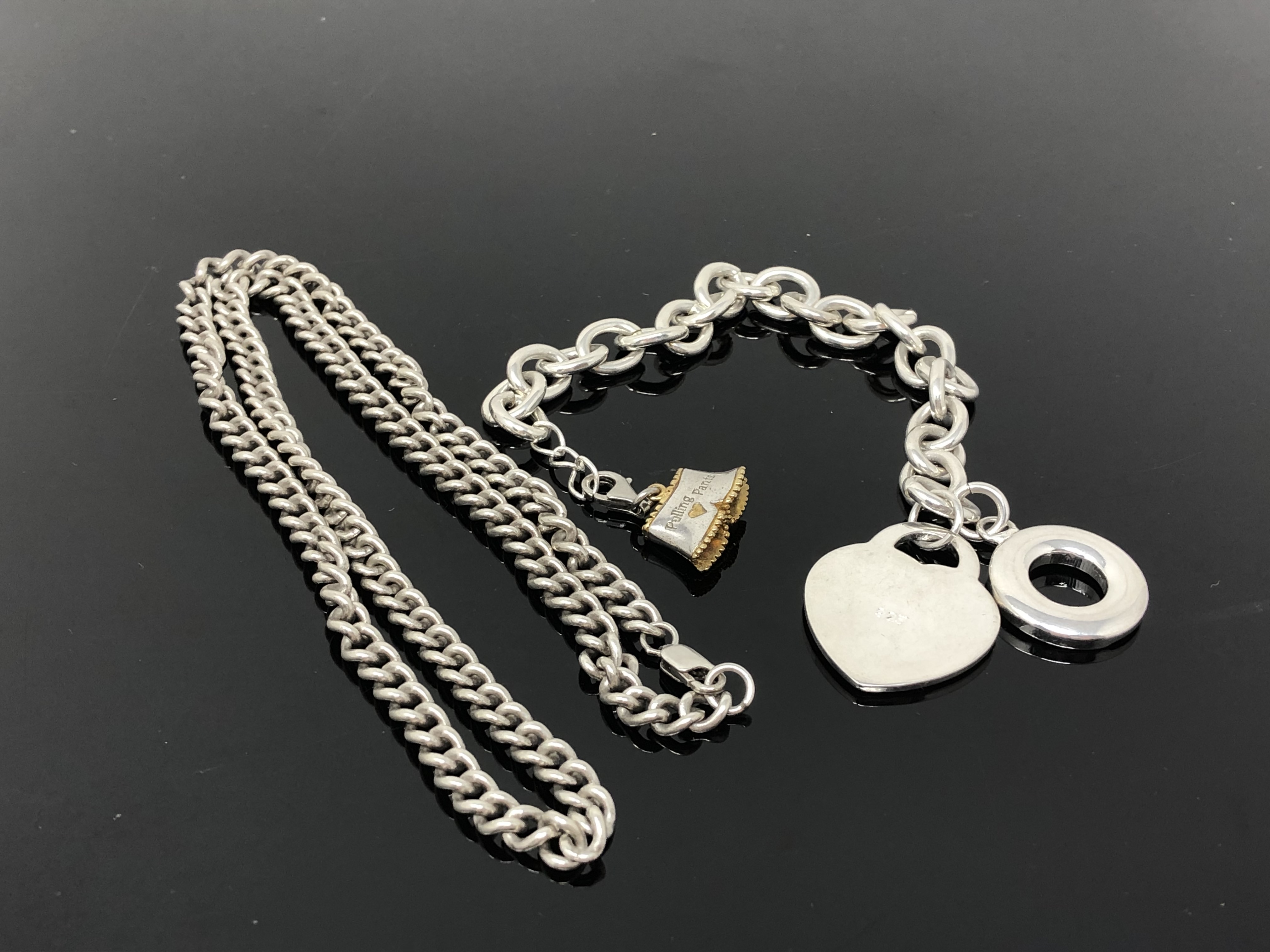 A silver bracelet together with a similar chain-link necklace. CONDITION REPORT: 72.