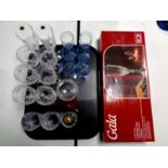 A box set of RCR champagne glasses together with a tray containing assorted drinking glasses to