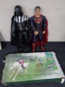 A boxed horse racing derby game together with two large action figures,