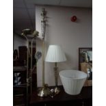 A brass standard lamp with matching table lamp together with a further brass floor lamp