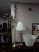 A brass standard lamp with matching table lamp together with a further brass floor lamp