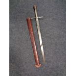 A short sword in leather scabbard