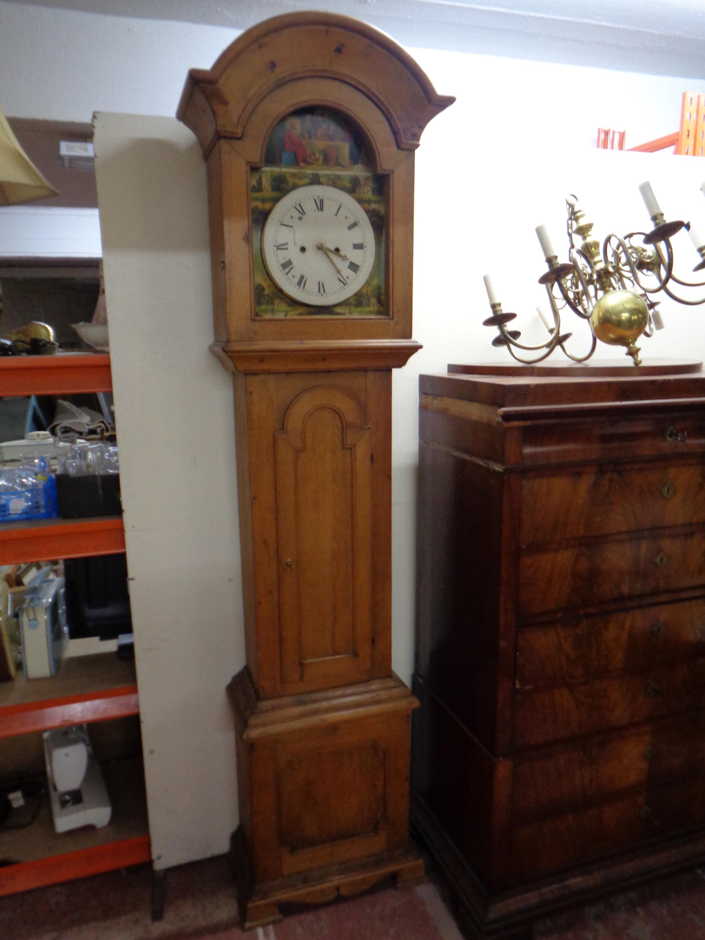 A 19th century continental oak longcase clock with painted dial and weights