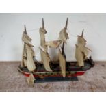 A wooden model of a four masted galleon