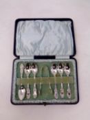 A set of six cased Birmingham silver teaspoons with matching sugar tongs dated 1900