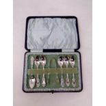 A set of six cased Birmingham silver teaspoons with matching sugar tongs dated 1900