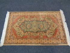 A woolen fringed Persian rug