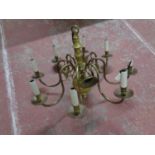 A continental brass eight branch chandelier