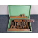 A 20th century painted pine box containing a quantity of vintage woodworking tools to include block