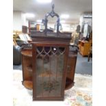 A Victorian mahogany wall cabinet with shelves,