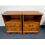 A pair of yew wood two drawer side cabinets