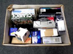 A box containing assorted electricals to include alarm clock radio, digital box, beauty massager,