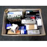 A box containing assorted electricals to include alarm clock radio, digital box, beauty massager,