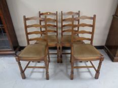 A set of four ladder back dining chairs