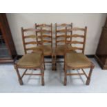 A set of four ladder back dining chairs