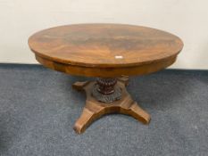 A nineteenth century Continental mahogany oval dining table on pedestal base