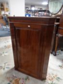 A 19th century mahogany corner cabinet