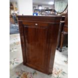 A 19th century mahogany corner cabinet