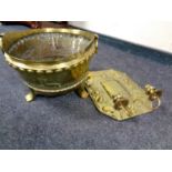 An antique brass twin handled coal bucket on raised feet together with a brass Art Nouveau wall