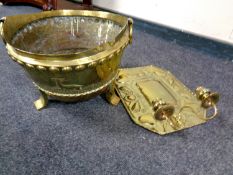 An antique brass twin handled coal bucket on raised feet together with a brass Art Nouveau wall