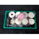 A box containing a quantity of haberdashery tape