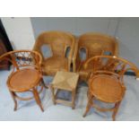 A pair of bamboo and wicker elbow chairs together with a further pair of bamboo and wicker
