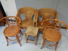 A pair of bamboo and wicker elbow chairs together with a further pair of bamboo and wicker