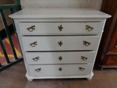 A 19th century painted pine four drawer chest