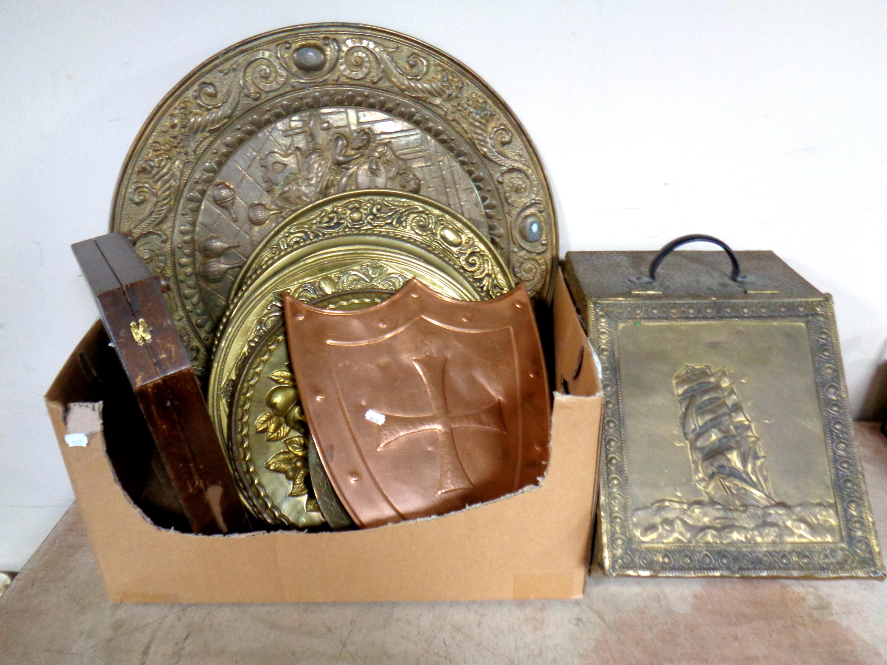 A box containing brass embossed coal receiver and fire screen, brass trays, cutlery canteen box,
