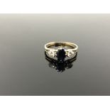 A 9ct gold sapphire and diamond ring, size R. CONDITION REPORT: 2.