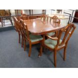 A Strong Bow Furniture inlaid yew wood twin pedestal extending dining table and six chairs,